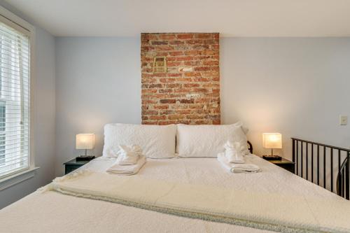 a bedroom with a bed with two towels on it at Dtwn at Your Door Historic Frederick Gem with Yard! in Frederick