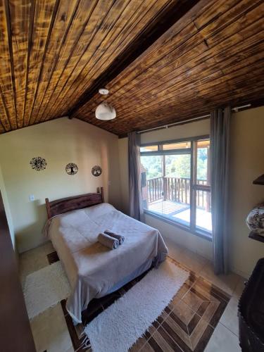 Ένα ή περισσότερα κρεβάτια σε δωμάτιο στο Casa do vadinho