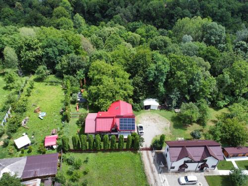 an aerial view of a farm with a red barn at PENSIUNEA STEFANIA in Brebu Mînăstirei