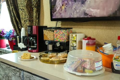 a counter top with food and snacks on it at Travel Inn in Sunnyside