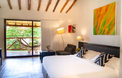 Postel nebo postele na pokoji v ubytování Sietemares Ecoposada & Spa