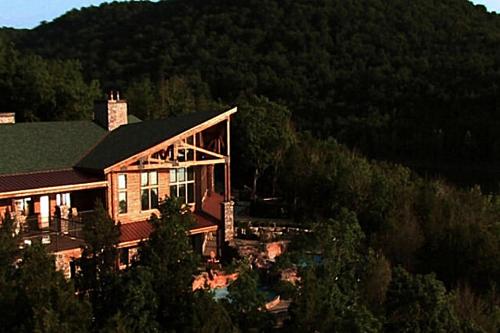 a large house in the middle of a mountain at Stonewater Cove in Shell Knob
