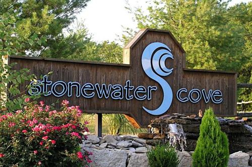 a sign for a store in a garden at Stonewater Cove in Shell Knob