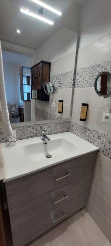 a bathroom with a sink and a mirror at a PICCIRIDDA in Taormina