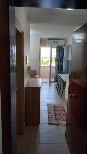 a view of a room with a kitchen and a living room at On the beach! in Shëngjin