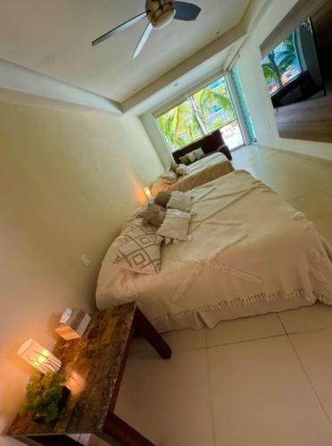 a bedroom with a large bed and a window at Icon Vallarta in Puerto Vallarta