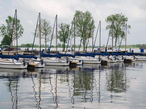 a group of boats docked in the water at Unique vacation home in Offingawier