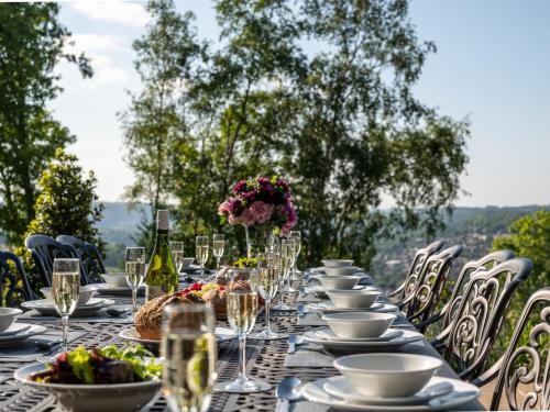 a long table with plates and wine glasses at 7 Bed in Matlock 89448 in Matlock Bank