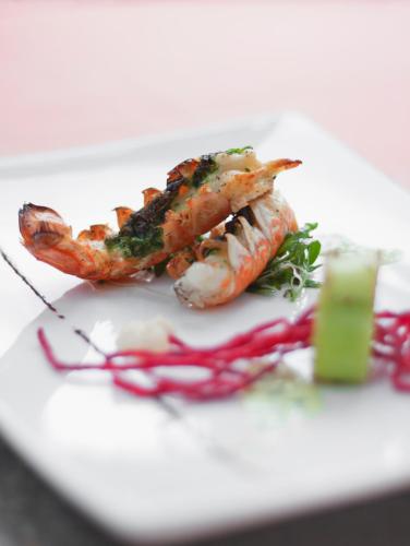 a plate of food with shrimp and vegetables on it at Best Western Tingvold Park Hotel in Steinkjer