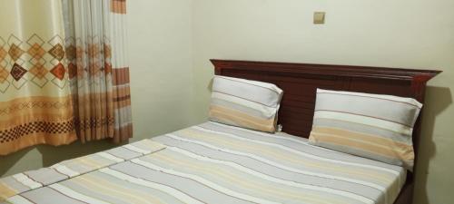 Postel nebo postele na pokoji v ubytování Simp & Comfort