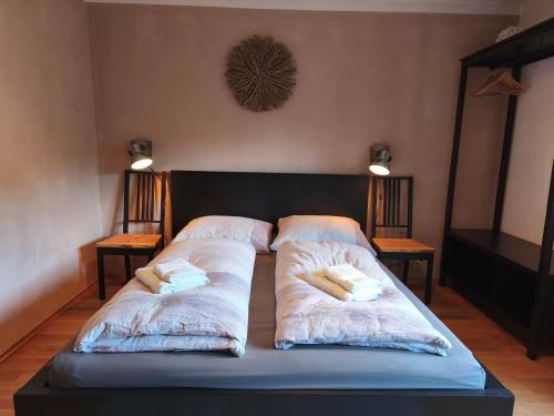 a bedroom with two beds with pillows on them at Sport Apartments Tirol in Umhausen