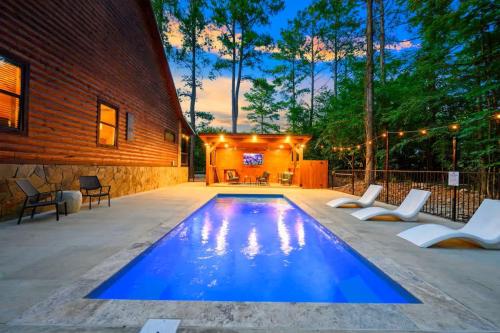 a swimming pool in the middle of a patio at After the Sunset 1-Level 5BR Pool - Arcade in Broken Bow