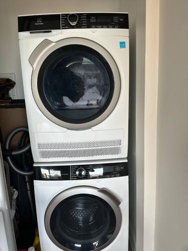 two machines are stacked on top of each other at Great view 1BDRM APTR in heart of Montreal DWTN in Montréal