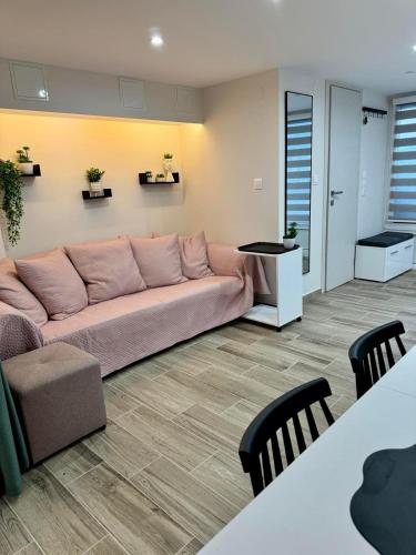 a living room with a couch and a table at Lucky Home Chios in Chios