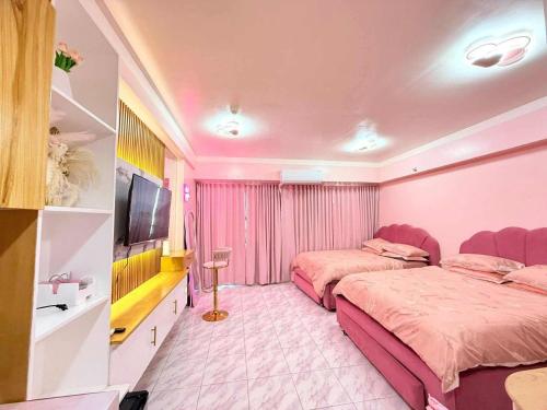 Ένα ή περισσότερα κρεβάτια σε δωμάτιο στο SMDC Style Residences Iloilo City