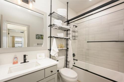 a bathroom with a toilet and a sink and a shower at Modern Granby Wonder by Leavetown Vacations in Granby