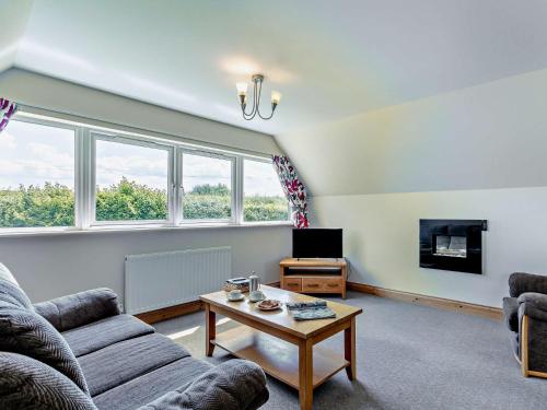a living room with a couch and a table at 3 Bed in Crediton WAIE3 in Zeal Monachorum