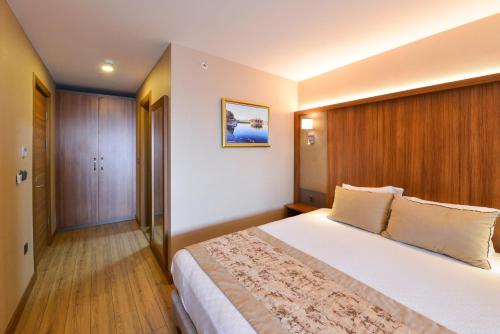 Postel nebo postele na pokoji v ubytování İstport Hotels