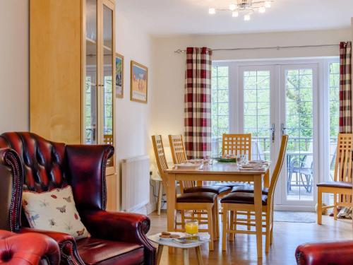 a living room with a table and chairs at 3 Bed in Stepaside FB047 in Stepaside