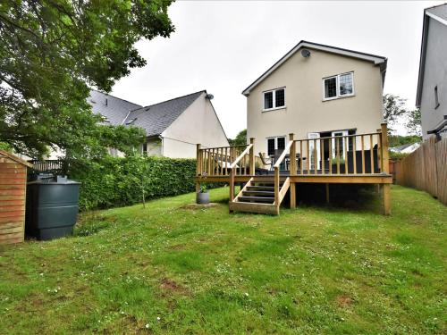 a house with a deck in the yard at 3 Bed in Stepaside FB047 in Stepaside