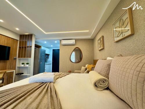 a bedroom with a large bed in a room at Beach Haus in Tambaú