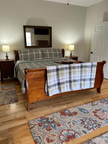 a bedroom with a bed and a mirror at Foxy Retreat in Nellysford