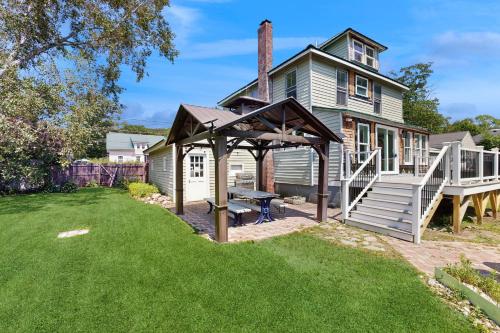 a backyard with a picnic table and a gazebo at Salt Air Serenity in Old Orchard Beach