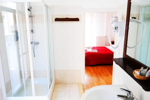 a bathroom with a shower and a toilet and a sink at Central Plaza in Lecce