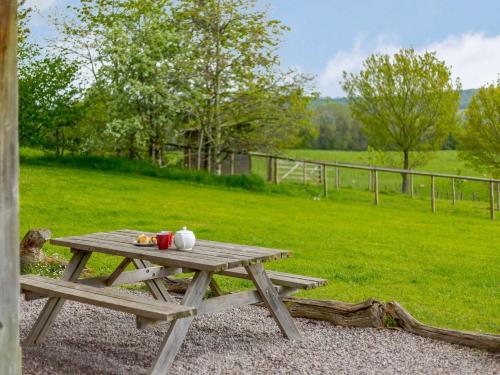 a picnic table with food on top of a field at 3 bed in Worcester CC037 in Clifton upon Teme