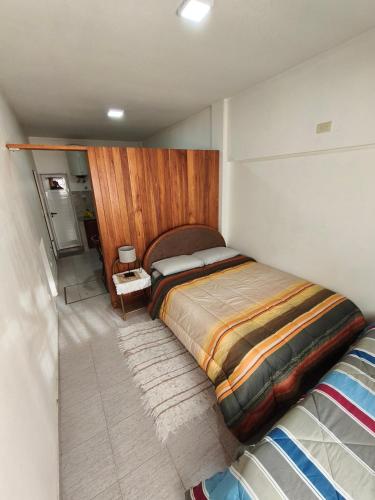 a bedroom with a large bed in a room at Hogar Argentina 2 in Quilmes