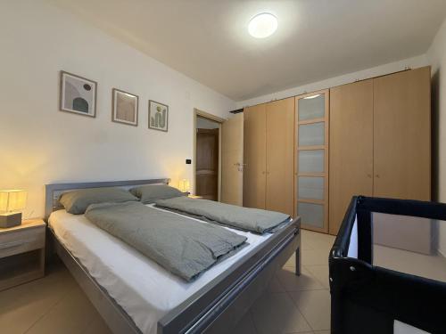 a bedroom with a large bed in a room at Zen in Umag