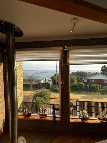 a window in a house with a view of a yard at Amazing Rooftop Views and Free Parking in Mirasol in Mirasol