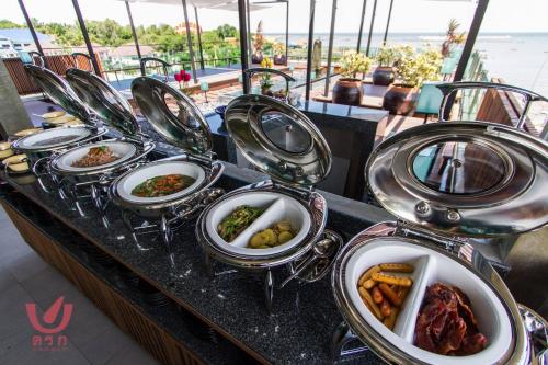 a bunch of plates of food on a buffet at Kroque Boutique & Bistro in Ang Sila