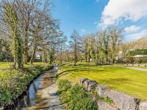 a river in a park with a stone wall at 2 Bed in Stepaside 91799 in Stepaside