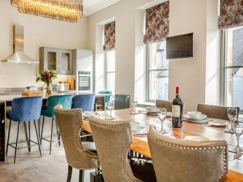a dining room with a table and chairs at The Embassy in Eyemouth