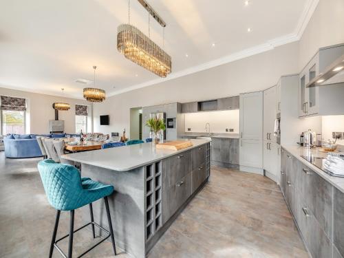 a kitchen with a large island in the middle at The Embassy in Eyemouth