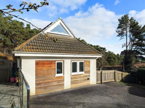 a small garage with a pitched roof at The Lodge in Carlyon Bay