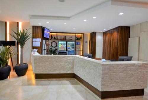 Ο χώρος του λόμπι ή της ρεσεψιόν στο Hotel Concord e Eventos corporativos Campo Grande