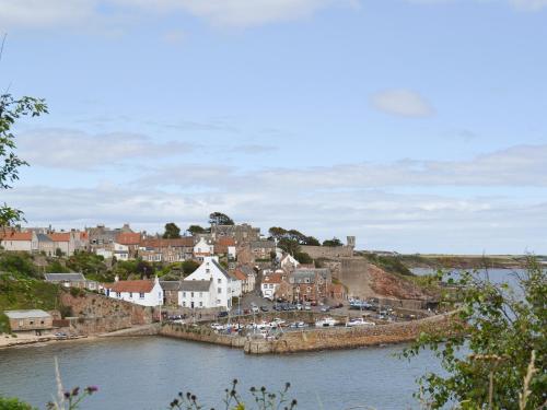 a town on the shore of a body of water at The Lodge At Lochnagar in Peat Inn 