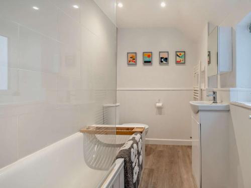 a white bathroom with a tub and a sink at 2 Bed in Beverley 93219 in Beverley