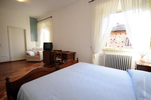 Katil atau katil-katil dalam bilik di Guest House Domus Urbino