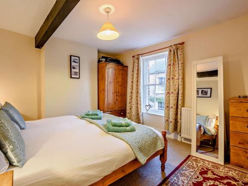 a bedroom with a large bed and a window at 2 Bed in Arundel 89671 in Arundel