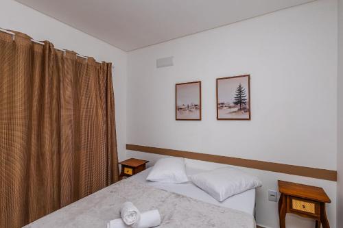 Ένα ή περισσότερα κρεβάτια σε δωμάτιο στο 700m da praia | Piçarras | 20min Beto Carrero