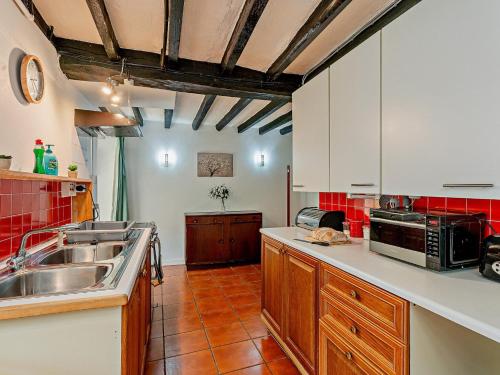a kitchen with a sink and a microwave at 2 Bed in Machynlleth 93079 in Cemmaes