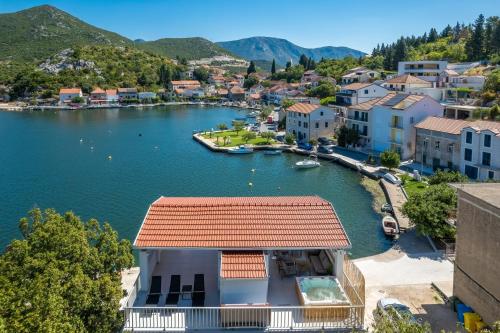 a view of a small town on a lake at Holiday house with a parking space Rogotin, Neretva Delta - Usce Neretve - 24802 in Rogotin