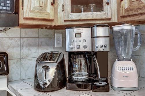 a kitchen counter with a coffee maker and a blender at Atrium Unit #108 Condo in Breckenridge