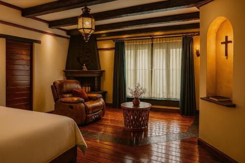 a bedroom with a bed and a chair and a window at Villa Coyoacán Colonial in Mexico City