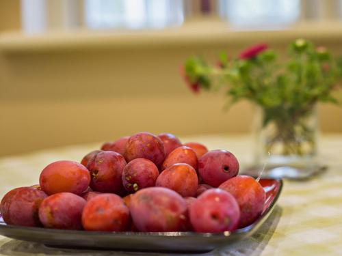 a bowl of red apples sitting on a table at 4 Bed in Wincle 95651 in Allgreave