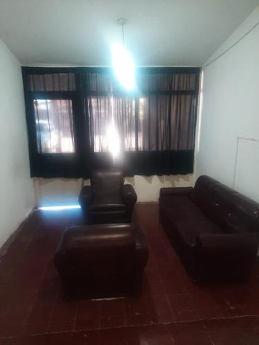 a living room with a couch and a window at Casa Alojamiento TELAR DE SUEÑOS in Belén