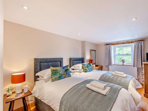 a bedroom with two beds and a window at 3 Bed in Appleby 94764 in Brampton